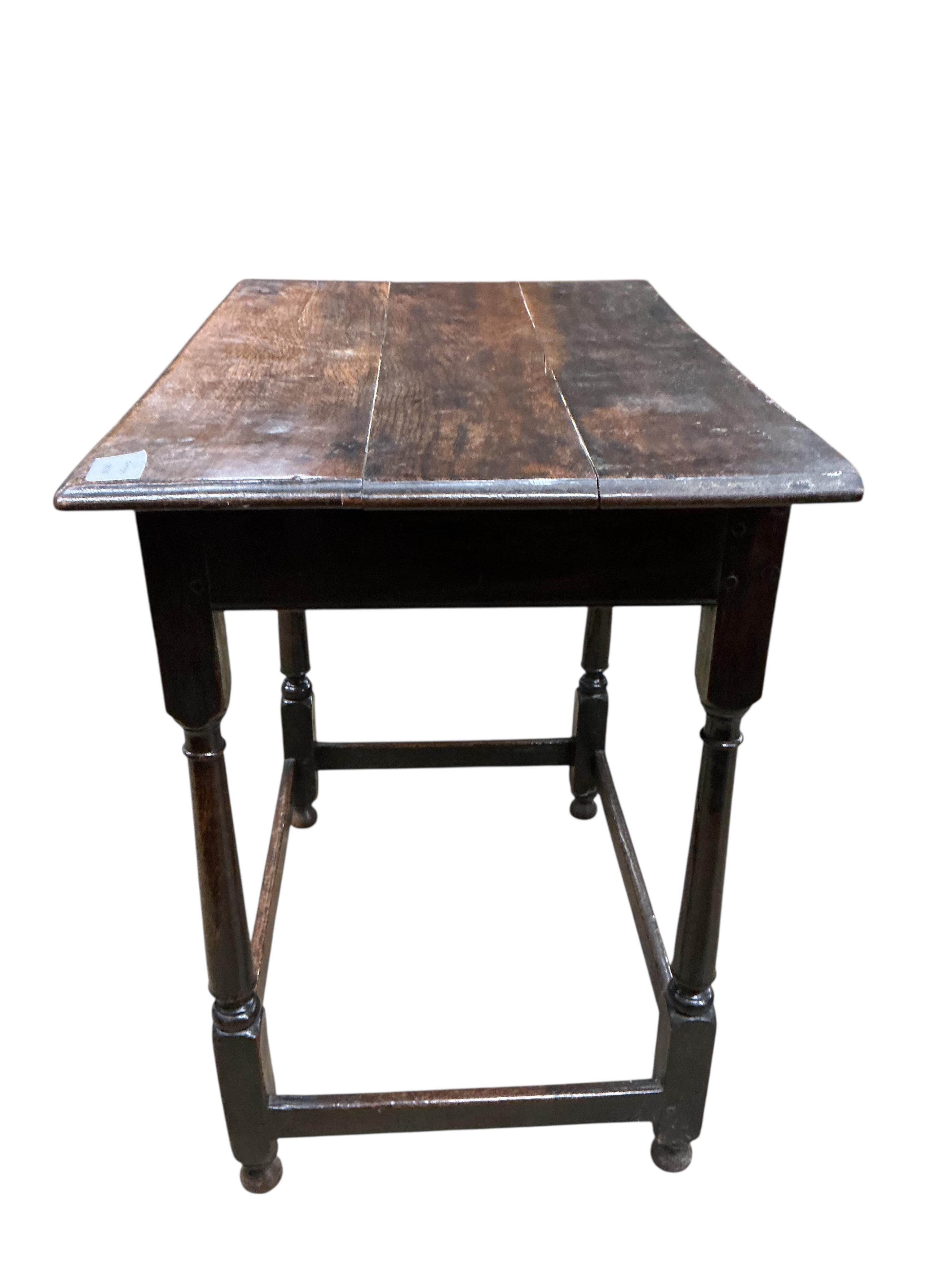 An early 18th century oak side table, fitted with a single long drawer, width 74cm, depth 49cm, height 74cm